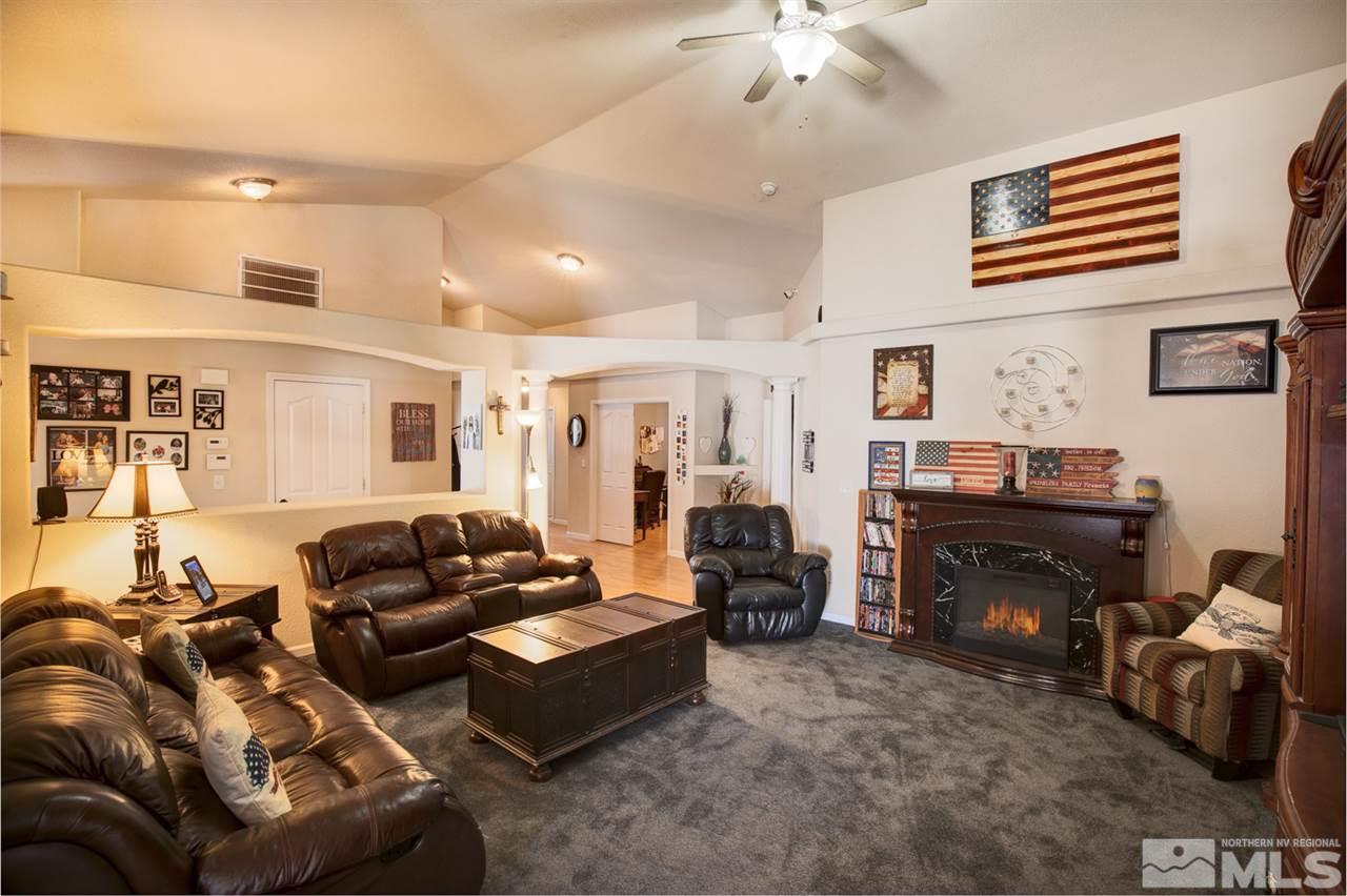 1895 Heidi Road Fallon, NV 89406 - Photo 4 of 24 a living room with furniture and a fireplace
