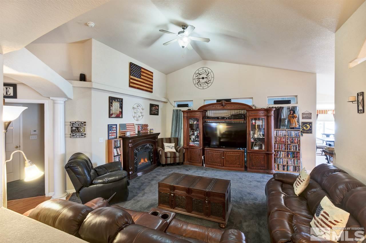 1895 Heidi Road Fallon, NV 89406 - Photo 5 of 24 a living room with furniture and a fireplace
