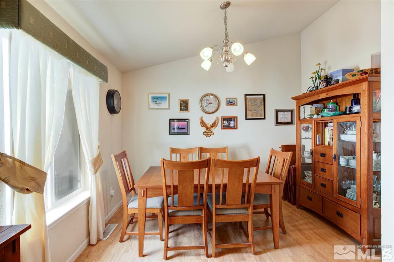 1895 Heidi Road Fallon, NV 89406 - Photo 8 of 24 a view of a dining room with furniture and chandelier