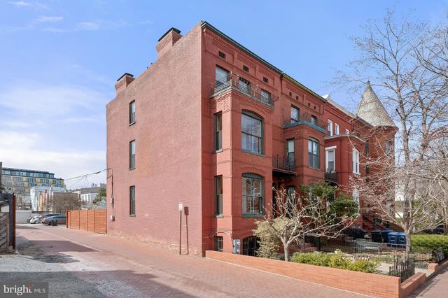 a front view of a building with street view