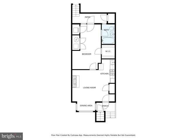 a front view of a house with plants