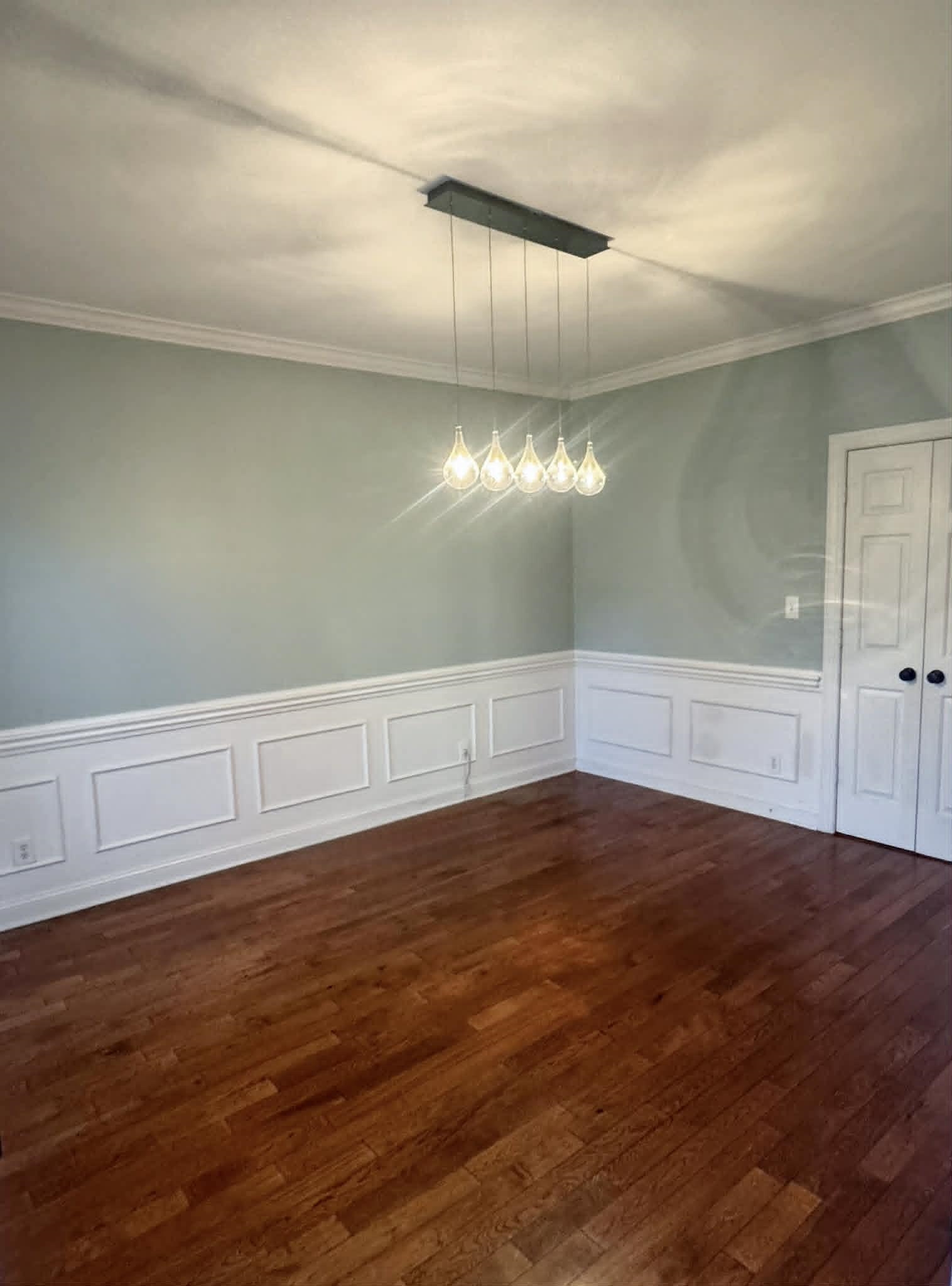 37 Crownpointe Cove Jackson, TN 38305 - Photo 15 of 39 Hardwood flooring throughout featuring an elegant chandelier