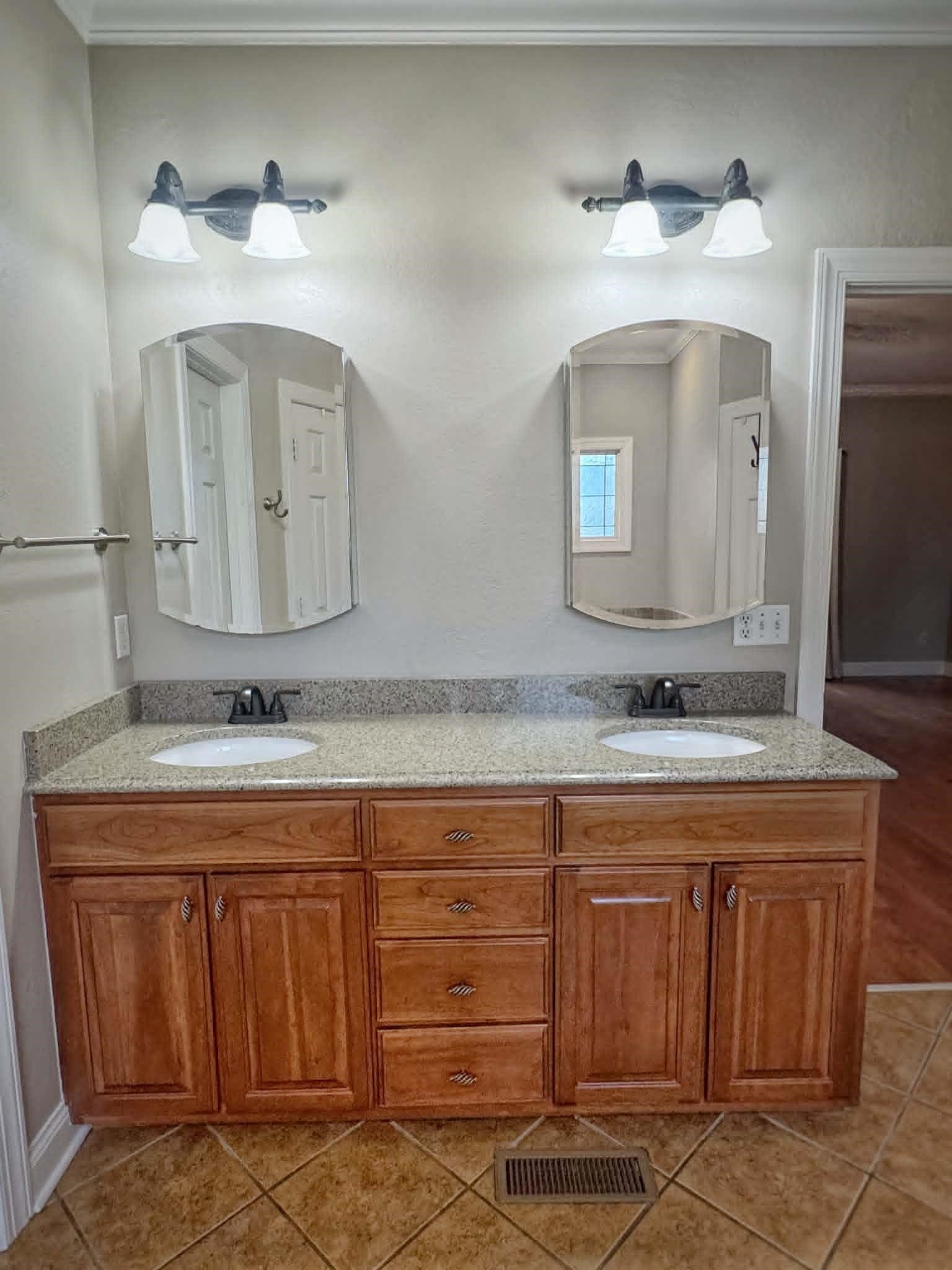 37 Crownpointe Cove Jackson, TN 38305 - Photo 18 of 39 Double vanity featuring wood cabinetry, integrated sinks, and a speckled countertop