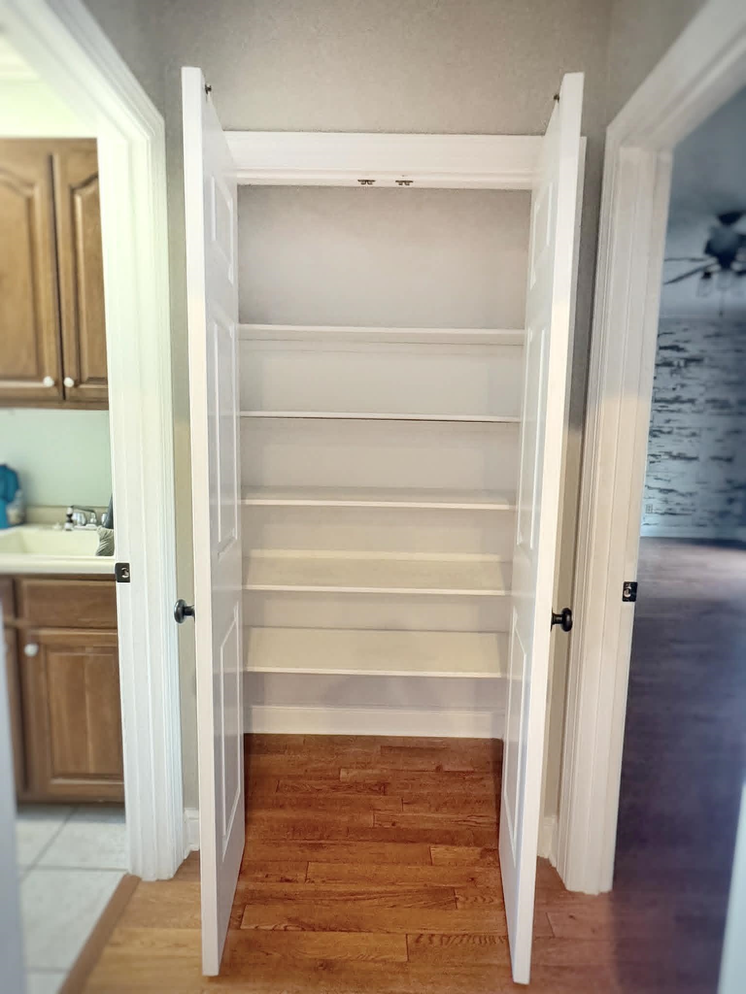 37 Crownpointe Cove Jackson, TN 38305 - Photo 23 of 39 Integrated pantry with multiple adjustable white shelves and hardwood-finish flooring
