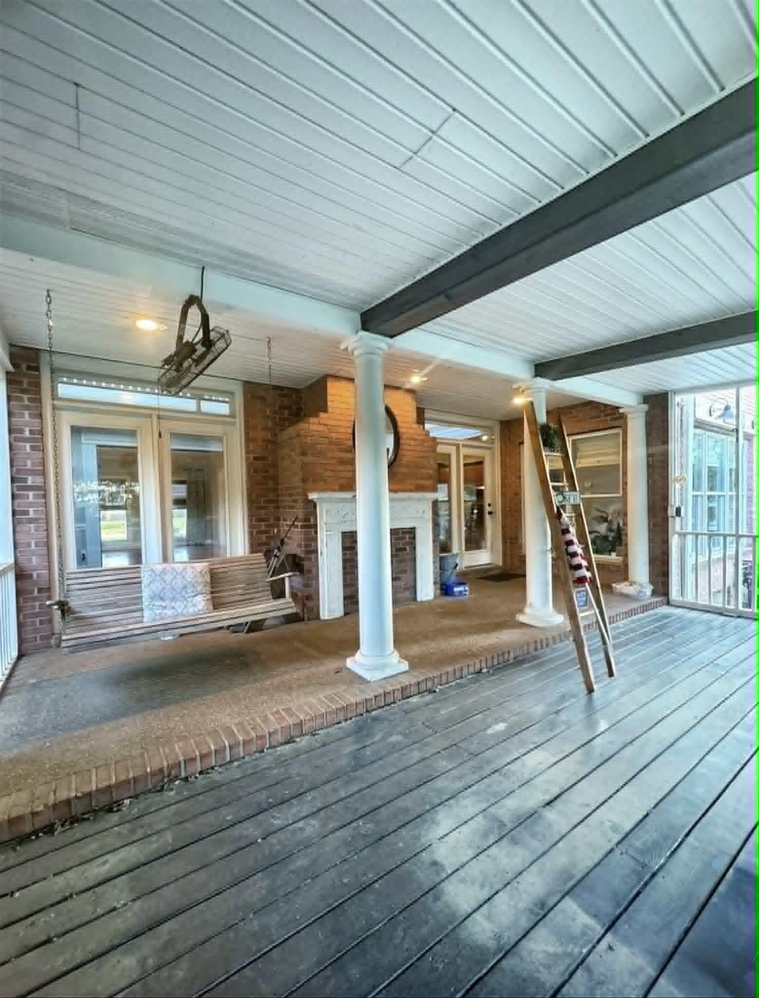 37 Crownpointe Cove Jackson, TN 38305 - Photo 27 of 39 Spacious screened porch featuring a dark wood-finish deck, brick foundation, white painted ceiling, and classical columns