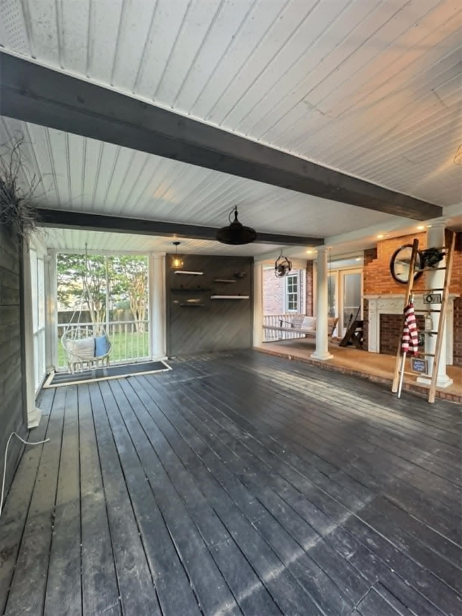 37 Crownpointe Cove Jackson, TN 38305 - Photo 33 of 39 Spacious screened porch featuring dark-stained wood-finish flooring, a white planked ceiling with exposed dark beams, and multiple windows