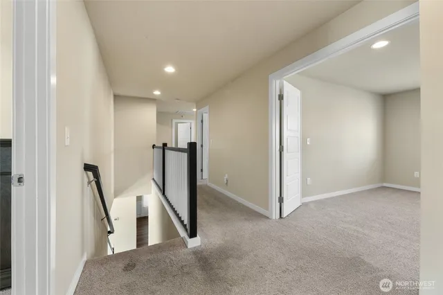 a view of a hallway with staircase