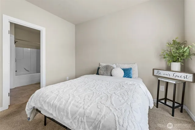 a bedroom with a bed and with furniture