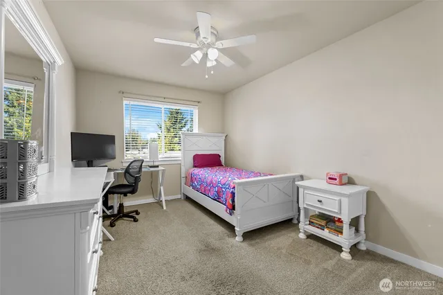 a bedroom with a workspace