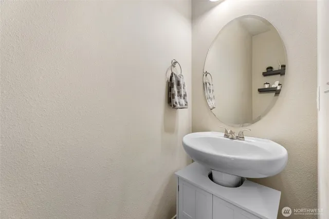 a bathroom with a sink and mirror