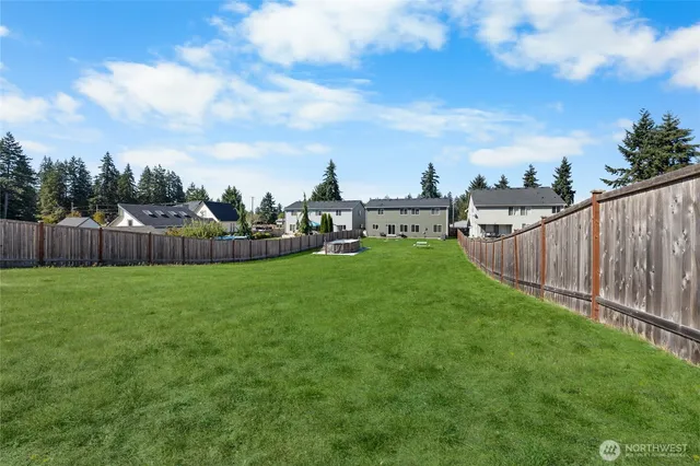 a view of a garden with a slide in the back