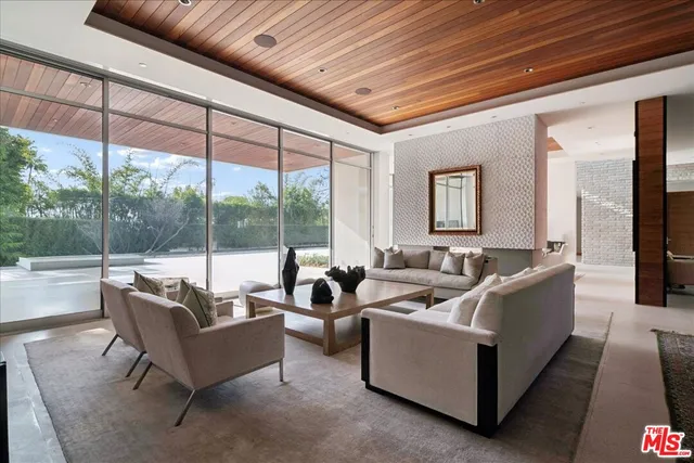 a living room with couches and a flat screen tv