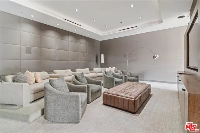 a view of a patio with a table and chairs and potted plants
