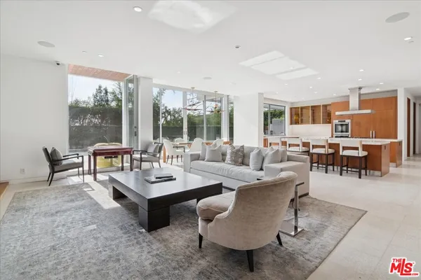 a living room with furniture and a table