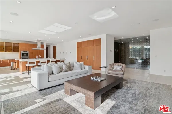 a living room with furniture and a table