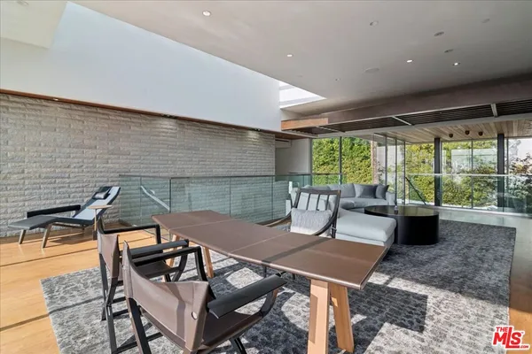 a patio with a table and chairs