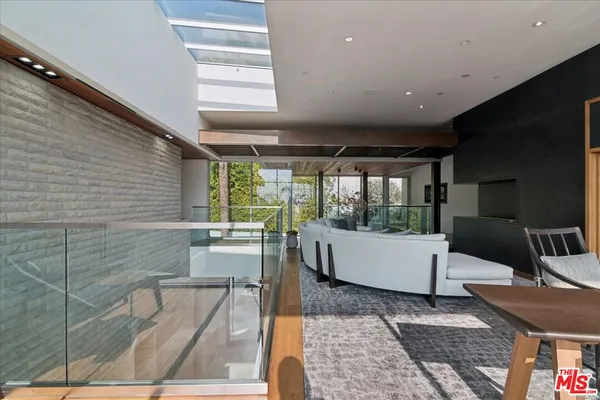 a bathroom with a bathtub and next to a window