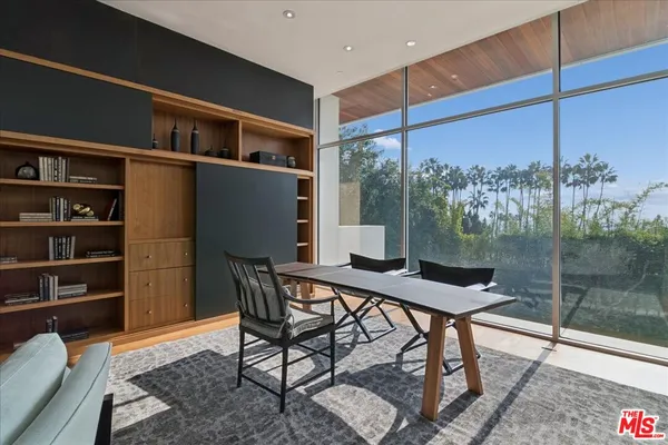 a workspace with furniture and window