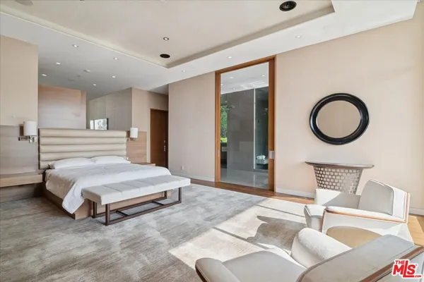 a bedroom with a bed and lamp