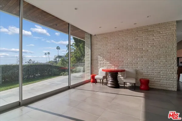 a view of livingroom with furniture and garden