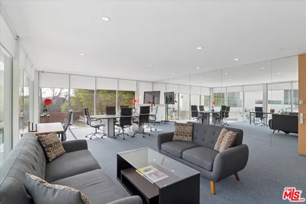 a view of house with swimming pool outdoor seating