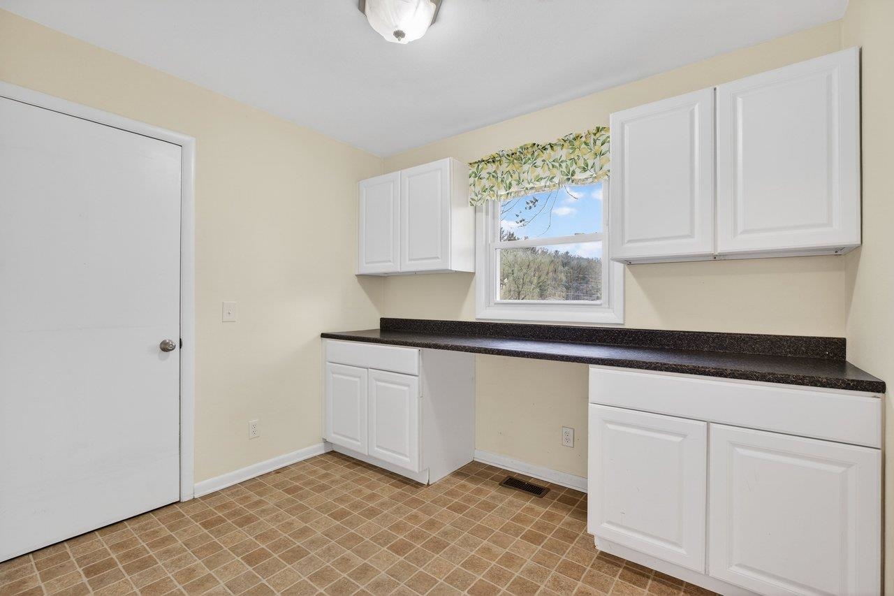 3259 Zion Church Road Broadway, VA 22815 - Photo 10 of 48 a kitchen with granite countertop white cabinets and sink