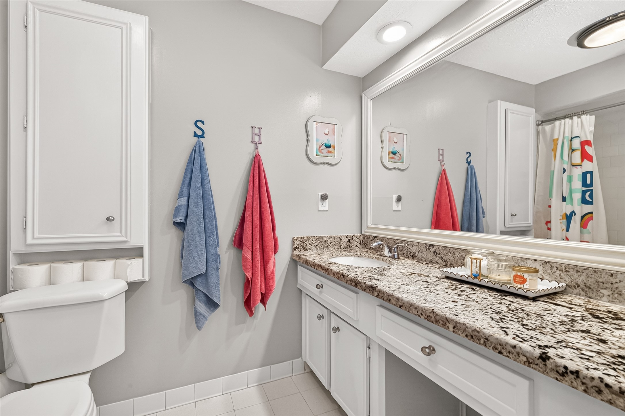 17611 Sorrell Ridge Drive Spring, TX 77388 - Photo 28 of 50 a bathroom with a granite countertop sink and a mirror