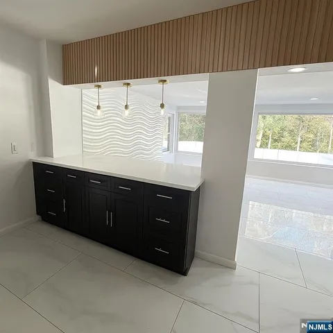 a bathroom with a sink vanity and a mirror