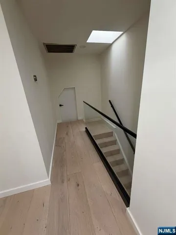 wooden floor with staircase