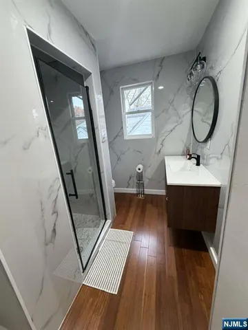 a living room with furniture and a mirror