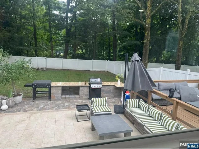 a view of a deck with couches table and chairs