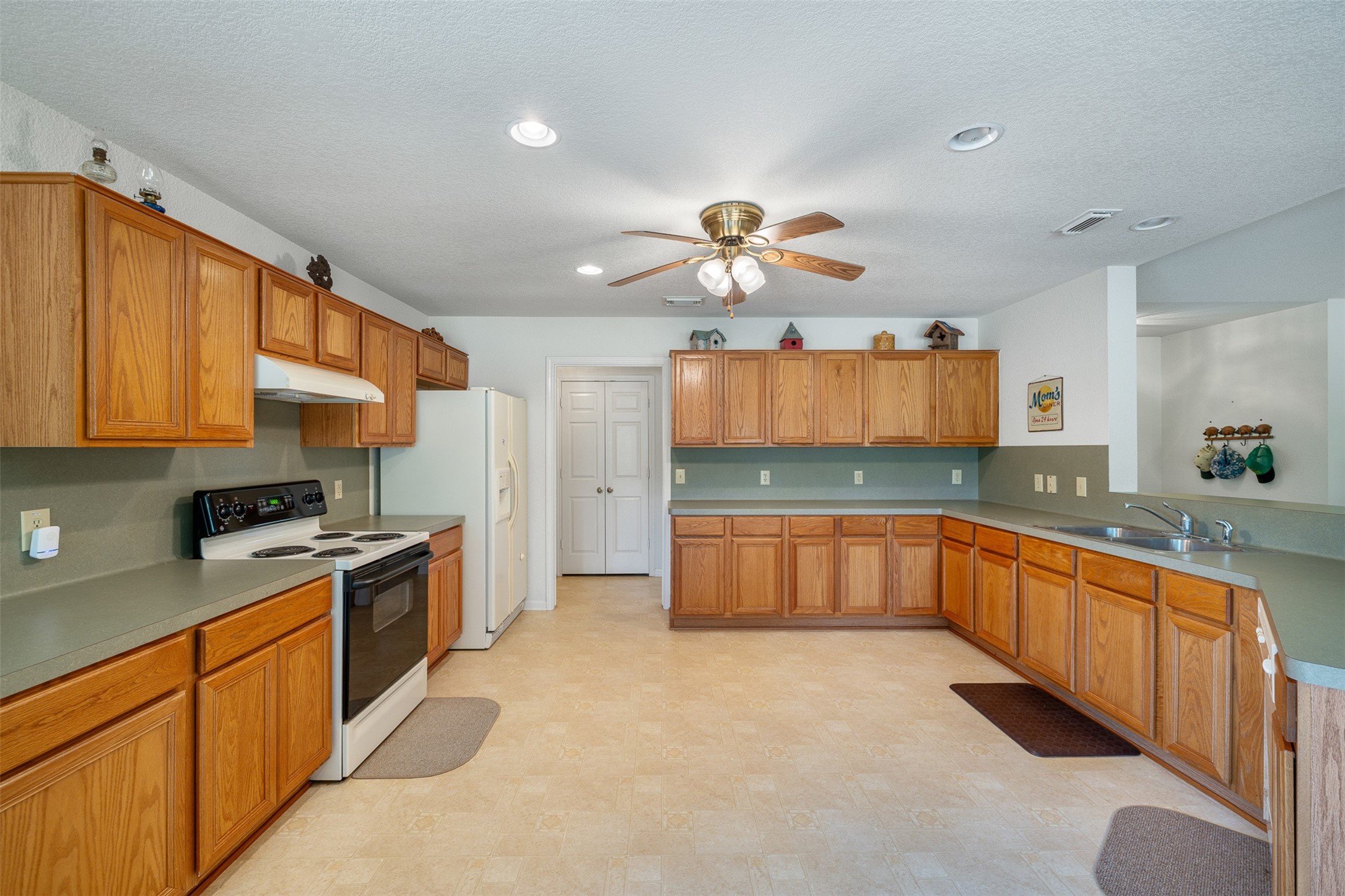 3300 Hills Road Carmine, TX 78932 - Photo 17 of 25 a large kitchen with stainless steel appliances granite countertop a stove cabinets and refrigerator