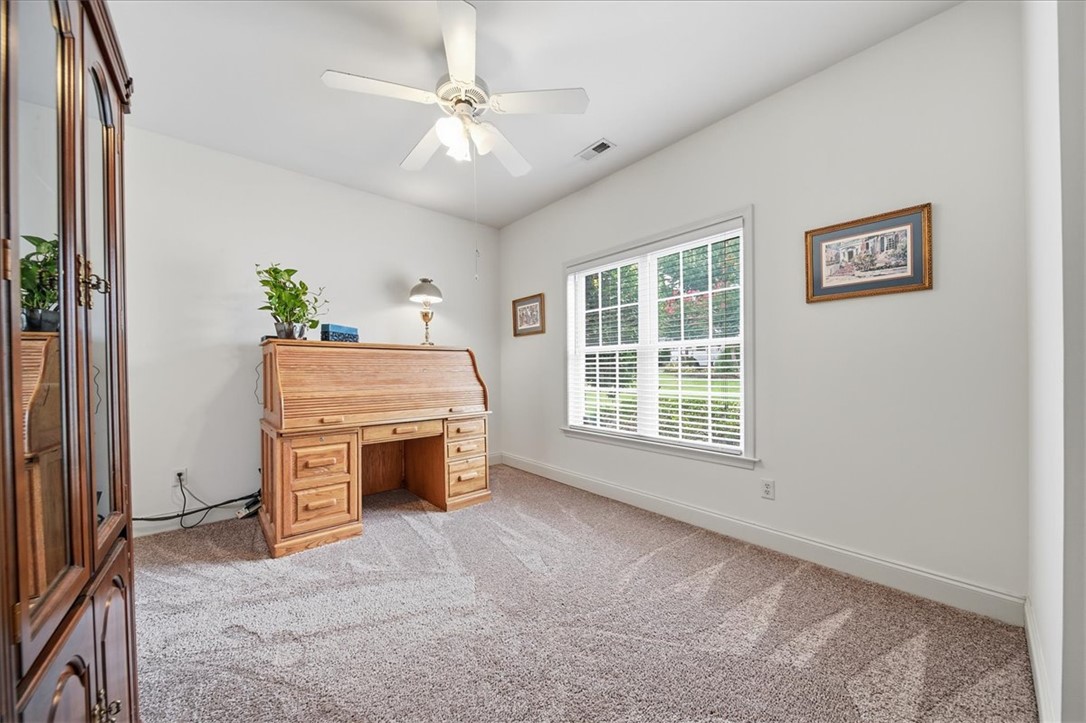 112 Elliott Circle Anderson, SC 29621 - Photo 15 of 35 A well-lit study with neutral carpeting offers a peaceful retreat for work or contemplation.