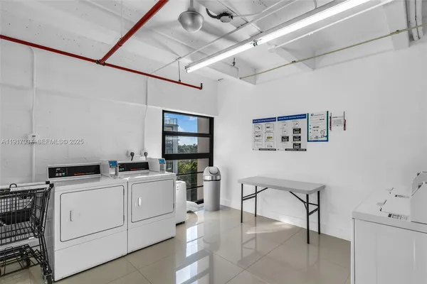 a view of a workspace with furniture