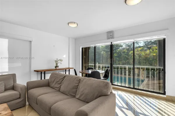 a living room with furniture and a window