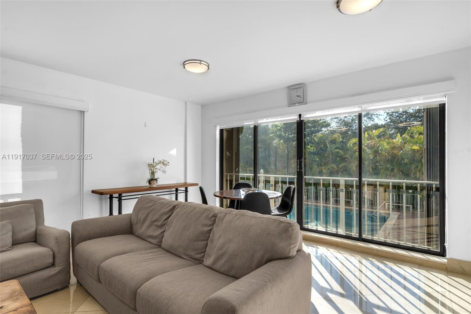 575 Crandon Boulevard, Unit 504 Key Biscayne, FL 33149 - Photo 29 of 46 a living room with furniture and a window