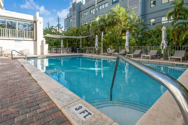 a view of a swimming pool with a patio