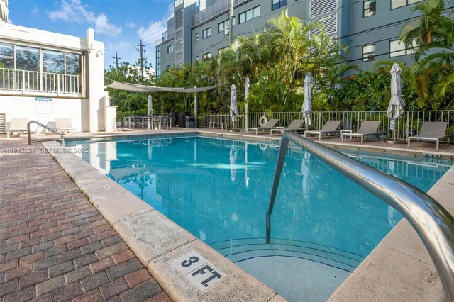 a view of a swimming pool with a patio