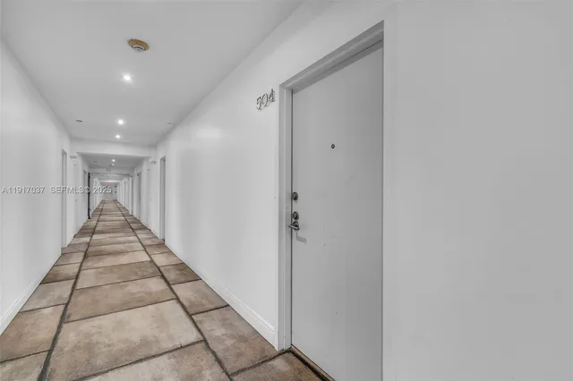 a hallway with sliding door and entryway