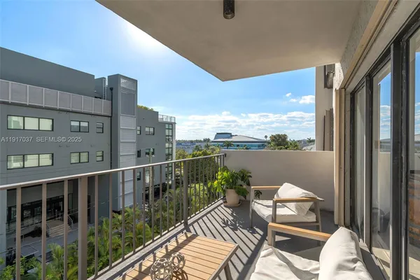 a view of balcony with furniture