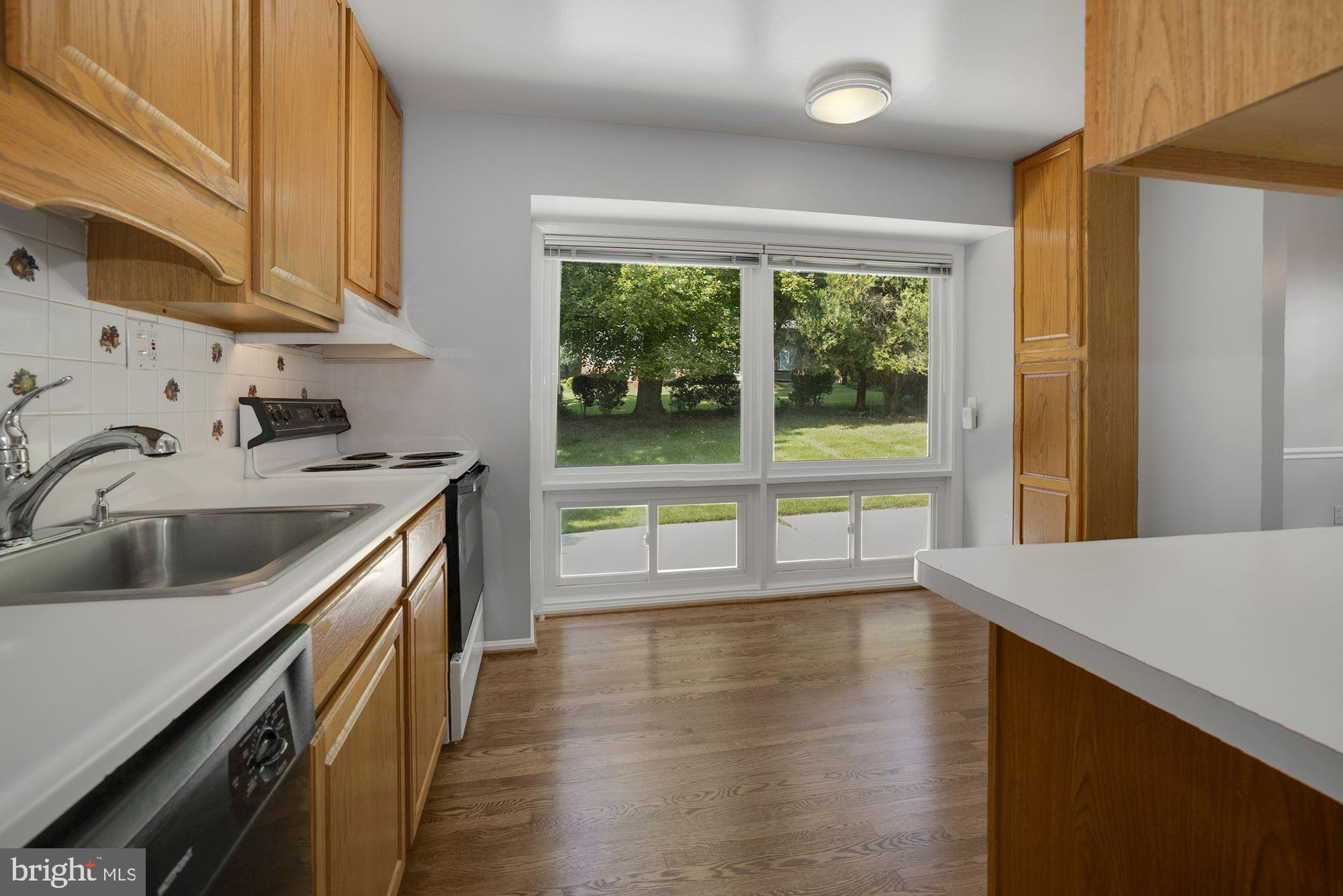 4105 Weller Road Silver Spring, MD 20906 - Photo 7 of 29 KITCHEN W/ VIEW TO BACKYARD