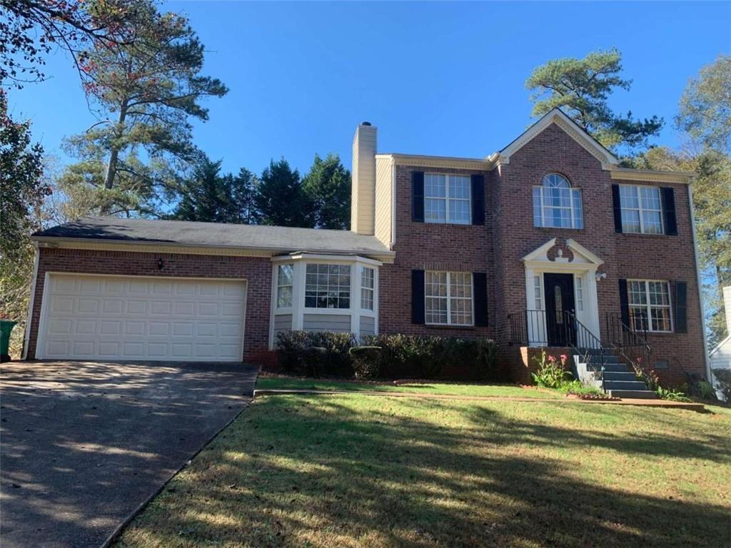 2649 Cloud Lane Decatur, GA 30034 - Photo 1 of 1 a front view of a house with a yard and garage