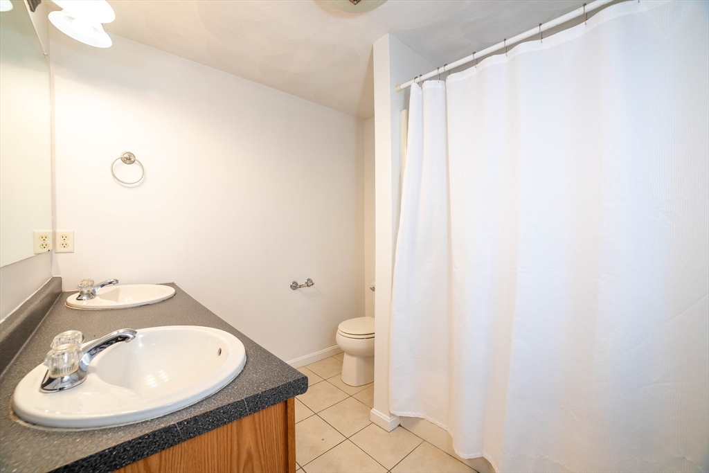 41 Mohave Road Worcester, MA 01606 - Photo 18 of 30 a bathroom with a sink toilet and a mirror