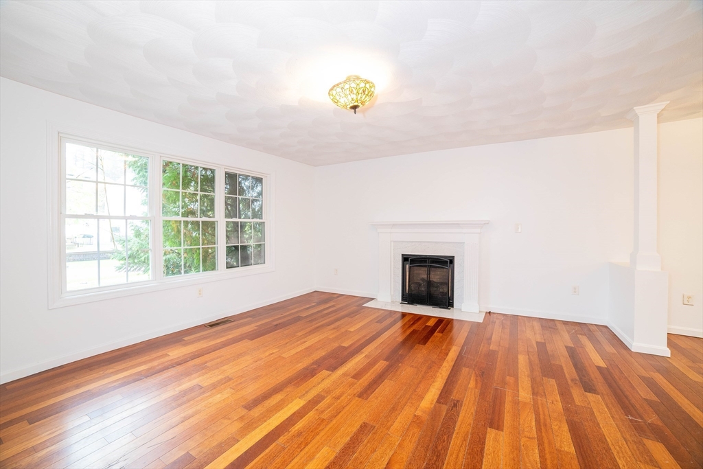 41 Mohave Road Worcester, MA 01606 - Photo 2 of 30 a view of an empty room with wooden floor and a window
