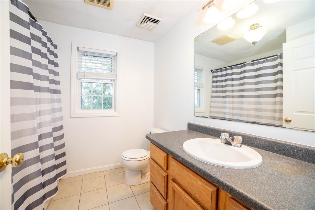 41 Mohave Road Worcester, MA 01606 - Photo 23 of 30 a bathroom with a sink a toilet and a mirror