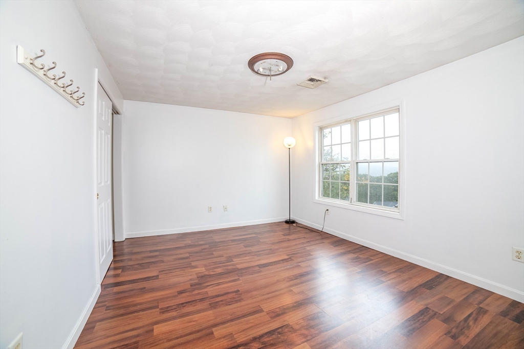 41 Mohave Road Worcester, MA 01606 - Photo 26 of 30 an empty room with wooden floor and windows