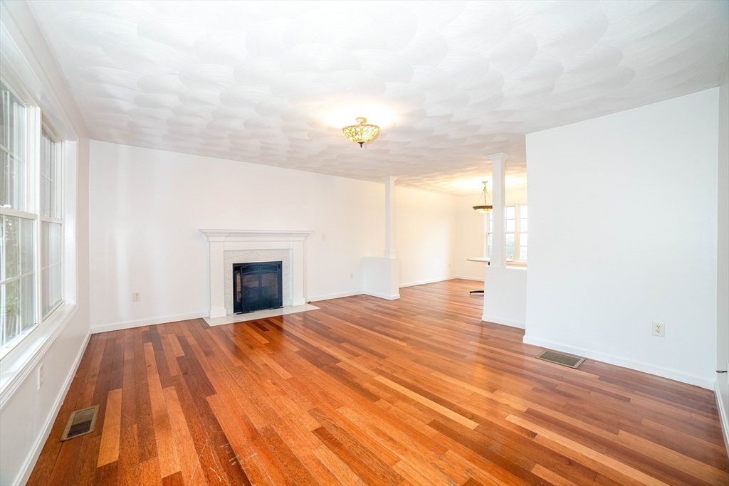 41 Mohave Road Worcester, MA 01606 - Photo 4 of 30 a view of an empty room with wooden floor and a window