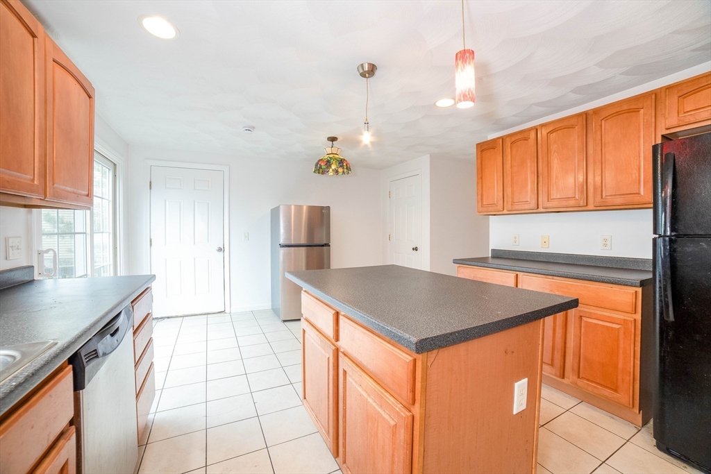 41 Mohave Road Worcester, MA 01606 - Photo 9 of 30 a kitchen that has a sink a stove and a table