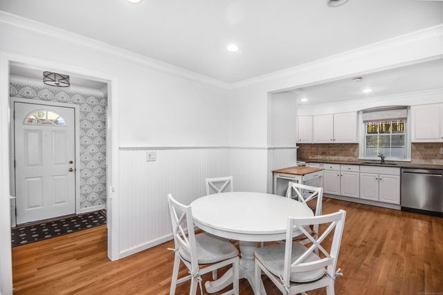 a kitchen with a table and chairs in it
