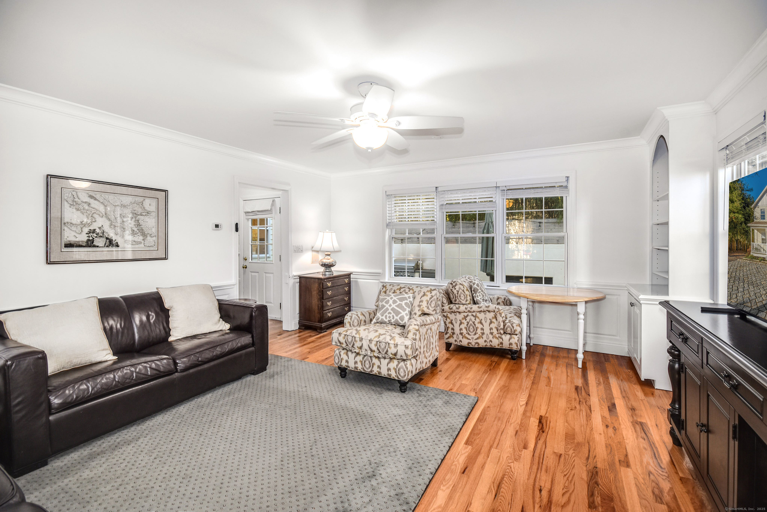 60 East Avenue New Canaan, CT 06840 - Photo 13 of 24 a living room with furniture and a fireplace